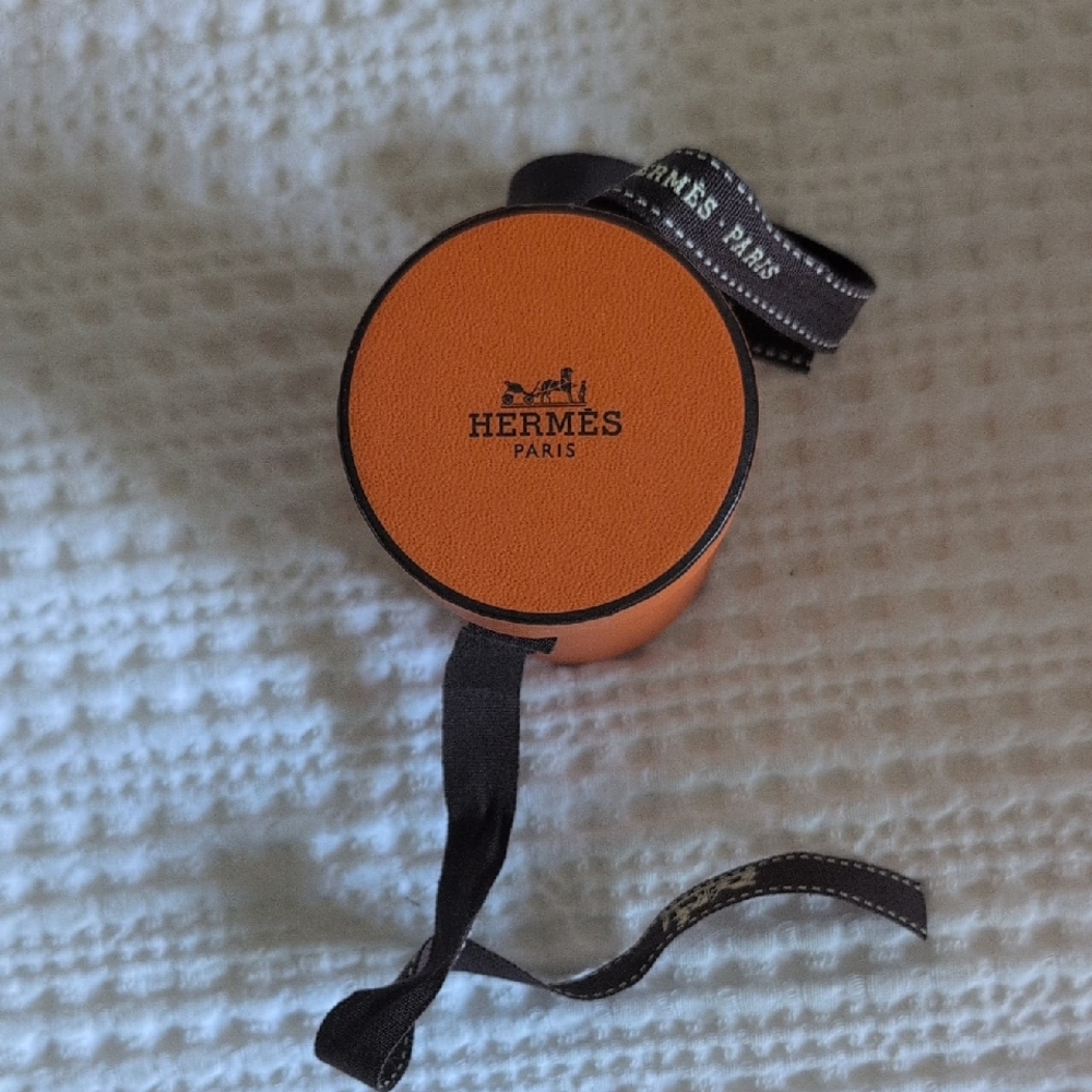 Hermès Orange Round Box with Black Ribbon